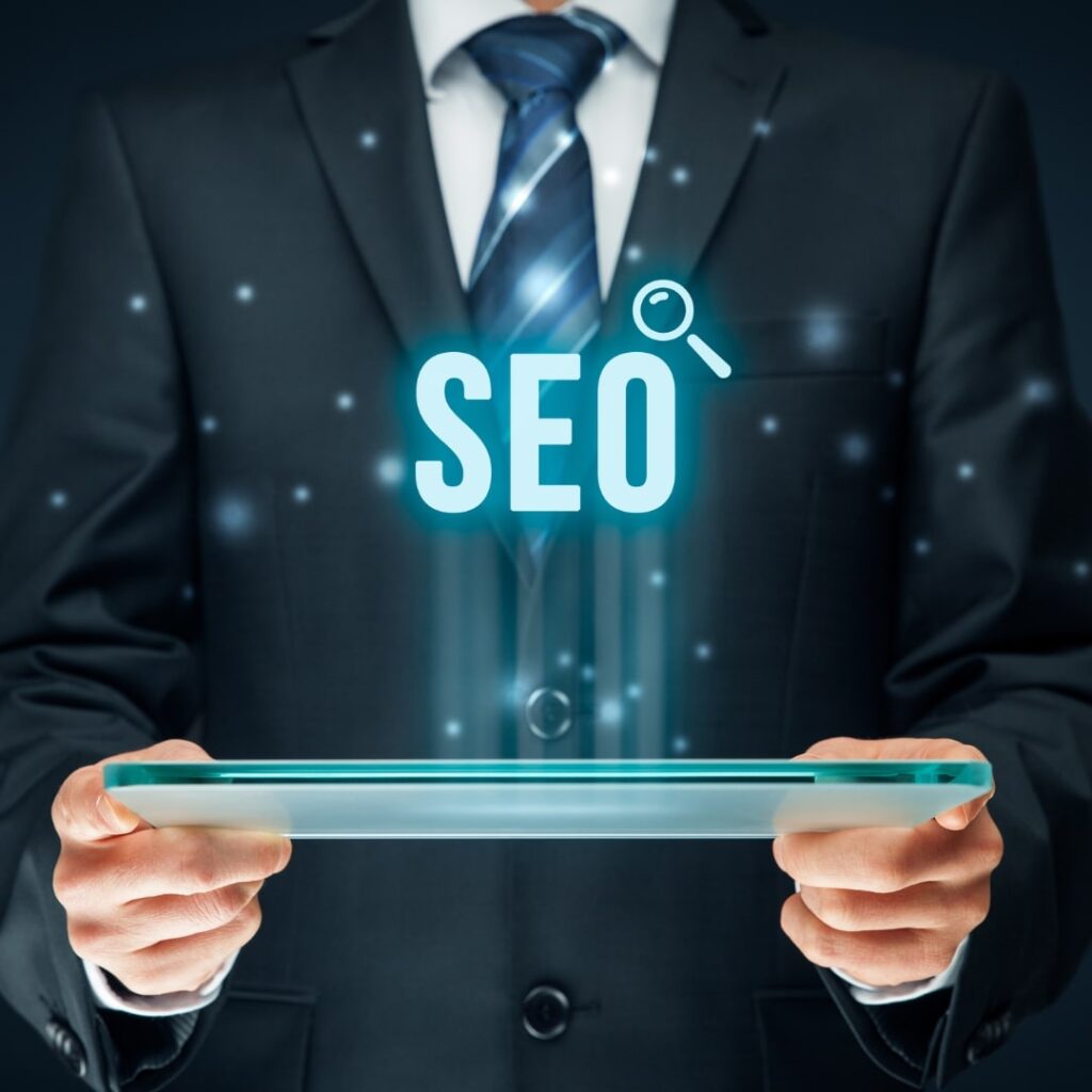 Image SEO Practices for Dental Websites shown with a businessman presenting glowing SEO text